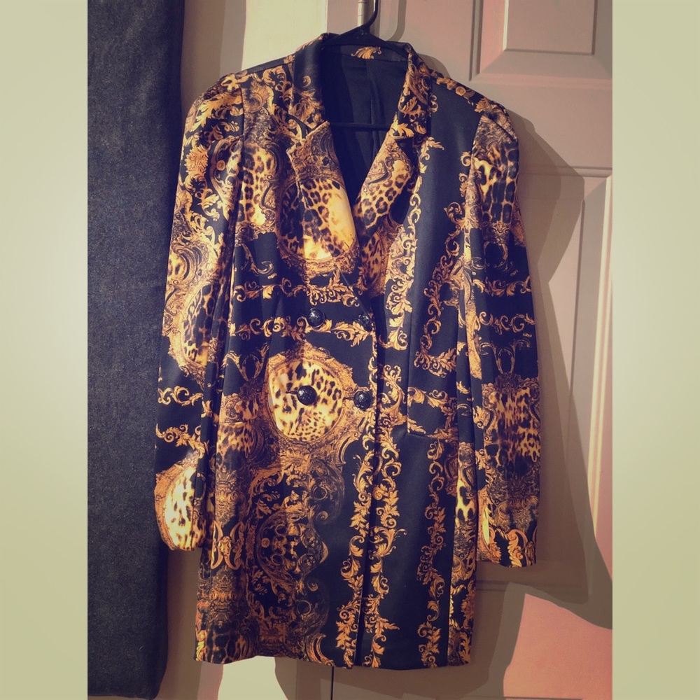 Gold and black patterned blazer dress.